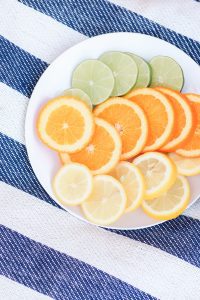 A plate of sliced citrus fruit