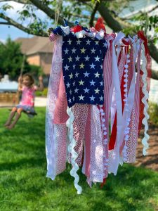 A smaller red, white, and blue American rag flag