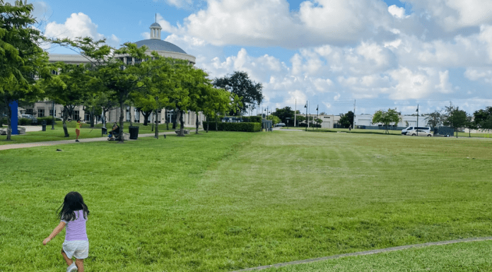 Valerie's daughter running in an open green space (Love Where You Live: Why I Love Living in Doral Valerie Barbosa Contributor Miami Mom Collective)
