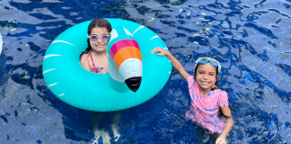 Vanessa's daughters playing in the pool (Sibling Rivalry: Tackle It With These 4 Strategies Vanessa Santamaria Contributor Miami Mom Collective)