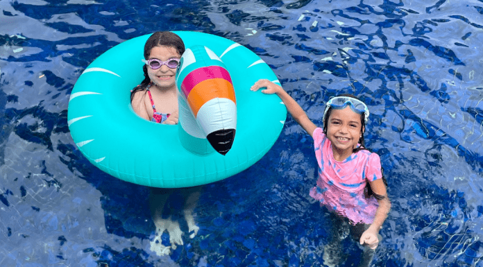 Sibling Rivalry: Tackle It With These 4 Strategies Vanessa's daughters playing in the pool (Sibling Rivalry: Tackle It With These 4 Strategies Vanessa Santamaria Contributor Miami Mom Collective)