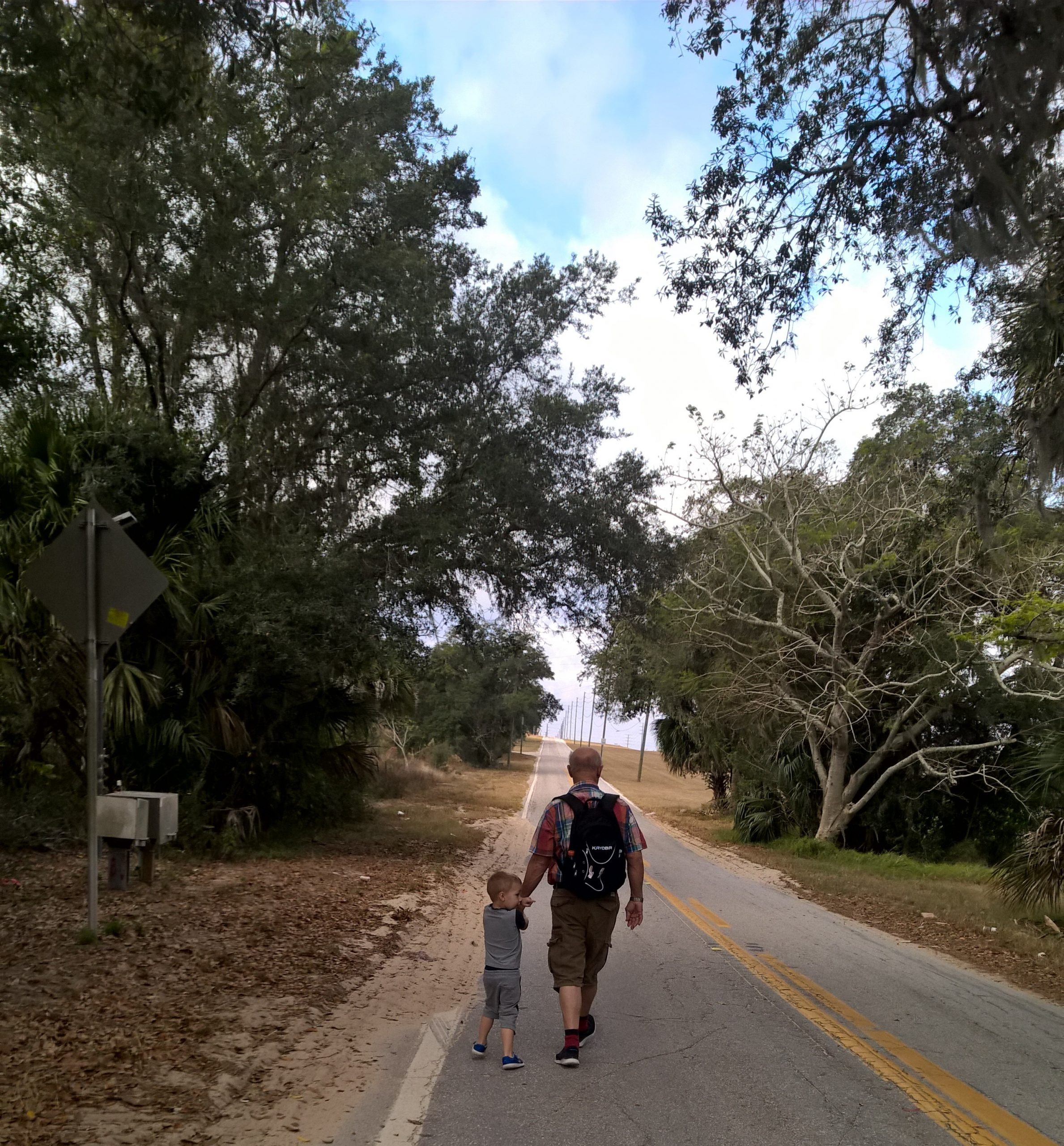 Rachell's son exploring the world with Grandpa (Rachel Hulsund Contributor Miami Mom Collective)