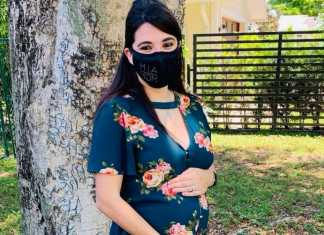 An expectant mom with her MIA Mom face mask (Booster Shots, Breakthrough Cases & the Latest on COVID Vaccine Safety Lynda Lantz Contributor Miami Mom Collective)