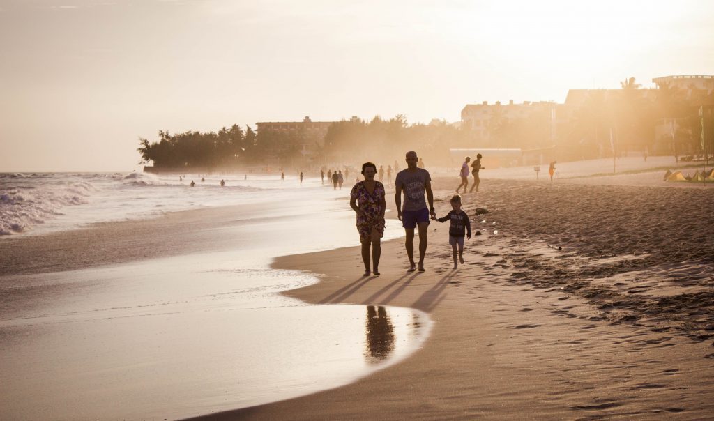 A family walking on the beach (Janeris Marte Contributor Miami Mom Collective)