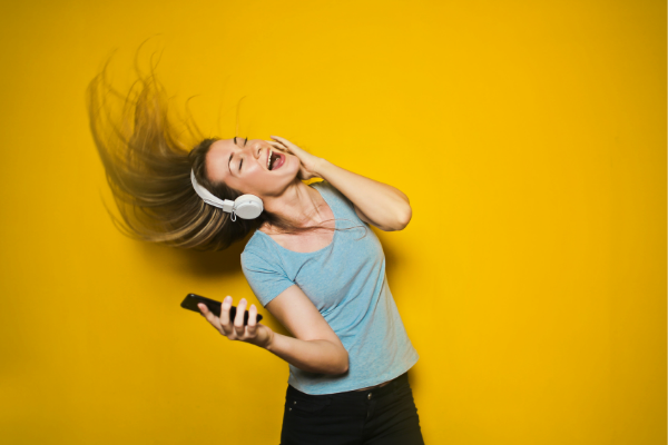 A woman listening to music (Lorena Lougedo Contributor Miami Mom Collective)