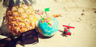Sunglasses, a pineapple, a toy airplane, and a globe (Fighting Summer Boredom Lorena Lougedo Contributor Miami Mom Collective)