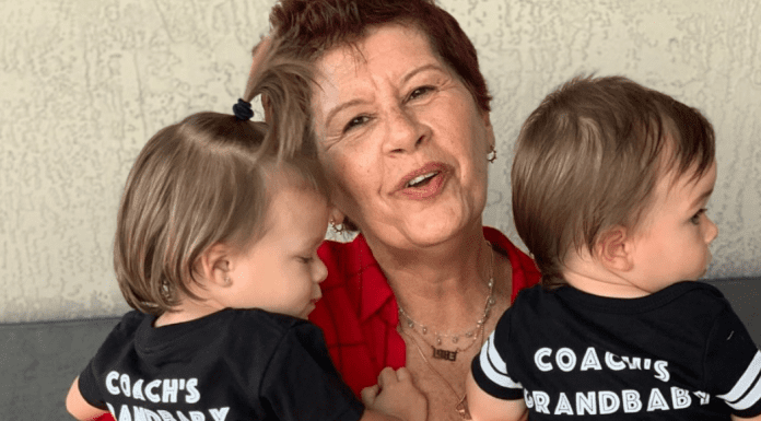 Image: Holly holding 2 of her grandchildren (I've Graduated to Grand! The Perks of Adding Grand to the Title of Mom Holly Farver Contributor Miami Mom Collective)