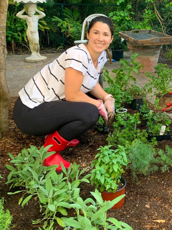 Aymee in her garden (Florida Garden: Start Yours During National Gardening Month Aymee Blanco Contributor Miami Mom Collective)
