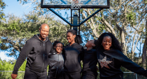 Image: A family enjoying a friendly game of basketball