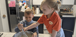 Rachel's kids stirring waffle batter (International Waffle Day: Like Music to My Ears Rachel Hulsund Contributor Miami Mom Collective)