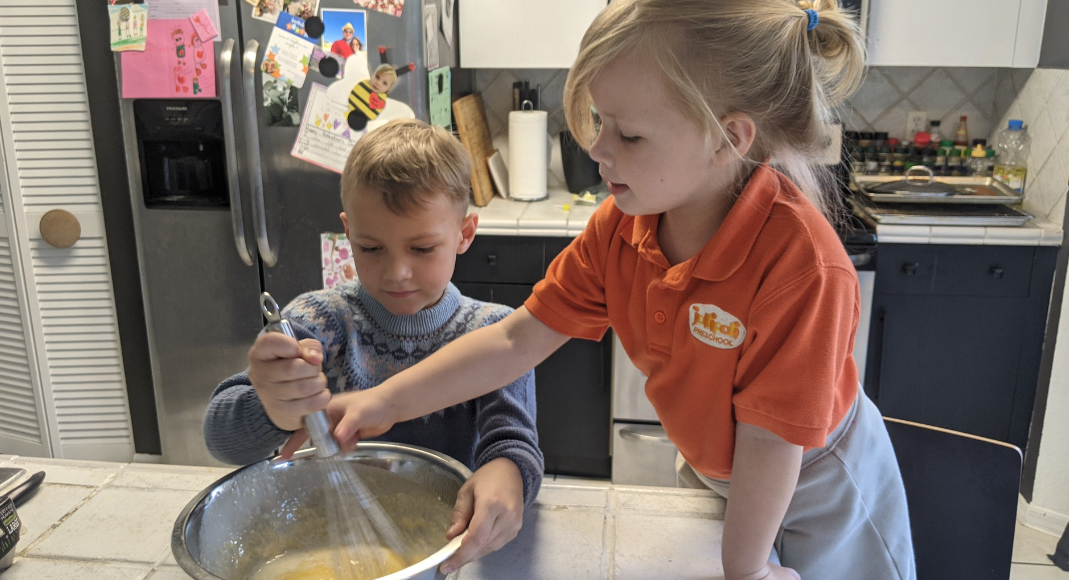 Rachel's kids stirring waffle batter (International Waffle Day: Like Music to My Ears Rachel Hulsund Contributor Miami Mom Collective)