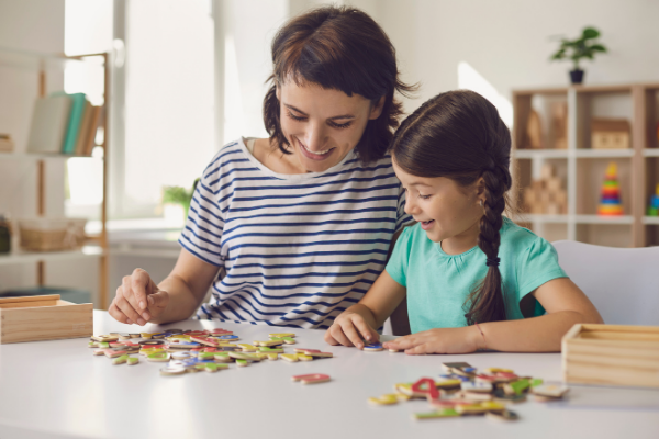 A mother and daughter doing a puzzle (Jessica Alvarez-Ducos Contributor Miami Mom Collective)