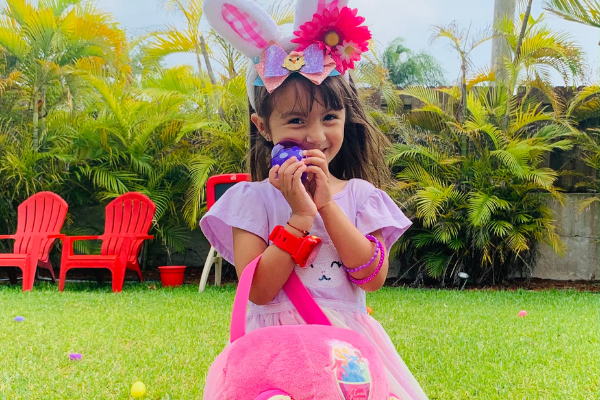 My daughter with a basket of eggs (Celebrating Easter With A Creative Egg Hunt Jessica Alvarez-Ducos Contributor Miami Mom Collective)