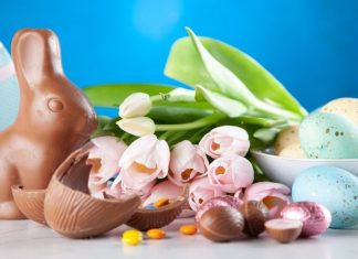 A chocolate Easter bunny with tulips and chocolate eggs (Celebrating Easter With A Creative Egg Hunt Jessica Alvarez-Ducos Contributor Miami Mom Collective)