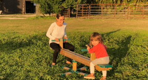 Kristina on a see saw with her daughter (Making Changes: Taking A Step Back In Order To Move Forward Kristina Fiorentino Contributor Miami Mom Collective)