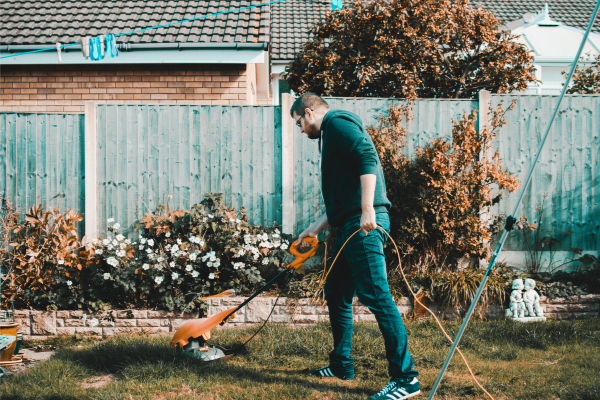 A man doing yard work (Lorena Lougedo Contributor Miami Mom Collective)