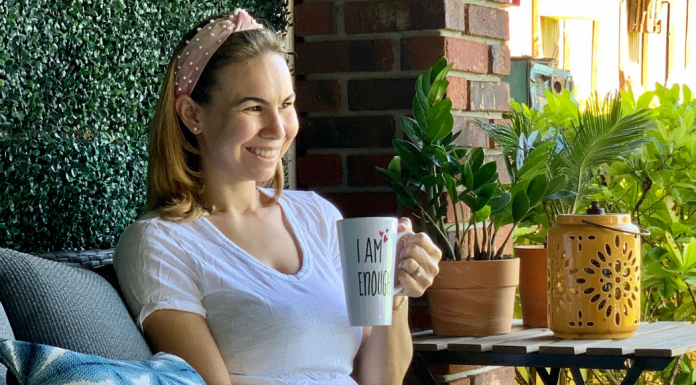 Miami Mom Collective Welcomes MIA Mom Jessica Socarras Jessica sitting with a cup of coffee (Miami Mom Collective Welcomes MIA Mom Jessica Socarras Contributor)