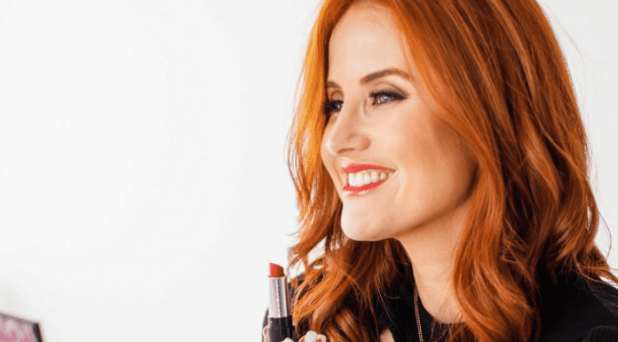 Dacia putting on some bright red lipstick (Momma Self-Care: People Love You the Way You Love Yourself Dacia Wiegandt Contributor Miami Mom Collective)