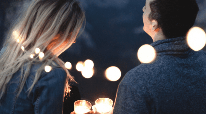 A couple sitting together (Dating Your Spouse: It's the Best Investment You'll Ever Make Rachel Hulsund Contributor Miami Mom Collective)