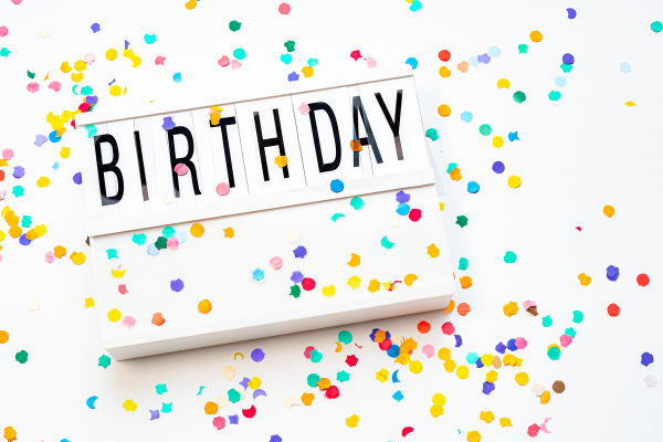 A festive birthday sign (Let's Celebrate: National Reading Across America Day Lorena Lougedo Contributor Miami Mom Collective)