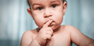 Image: A baby with a skeptical expression (I’m a Dietitian, and I Hated Feeding My Baby Solid Food (At First) | Part 1 Monica Auslander Moreno Contributor Miami Mom Collective)