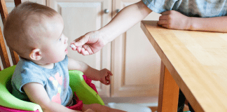 I’m a Dietitian, and I Hated Feeding My Baby Solid Food (At First) | Part 3 An older sibling feeds a toddler a cracker