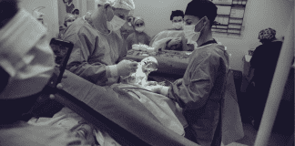 A woman giving giving birth by C-section (Covid-19, Labor & Visitation: What You Need to Know Dianna Hill Contributor Miami Mom Collective)