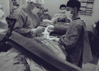 A woman giving giving birth by C-section (Covid-19, Labor & Visitation: What You Need to Know Dianna Hill Contributor Miami Mom Collective)