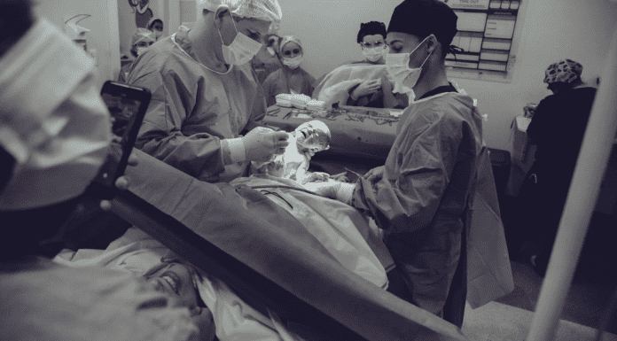 A woman giving giving birth by C-section (Covid-19, Labor & Visitation: What You Need to Know Dianna Hill Contributor Miami Mom Collective)