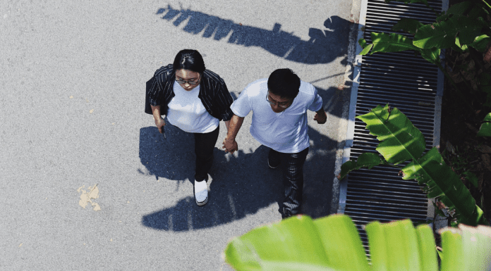 A couple holding hands and going for a walk (Creative Date Night Ideas on a Budget Becky Gonzalez Contributor Miami Mom Collective)