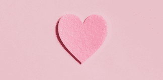 A pink paper heart (More Self-Love in 2021: 7 Ways to Love Ourselves Daily Rachelle Haime Contributor Miami Mom Collective)