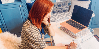 Dacia working at her desk (Steps for Creating Vision and Clarity for the New Year Dacia Wiegandt Contributor Miami Mom Collective)