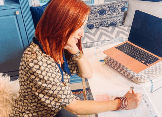 Dacia working at her desk (Steps for Creating Vision and Clarity for the New Year Dacia Wiegandt Contributor Miami Mom Collective)
