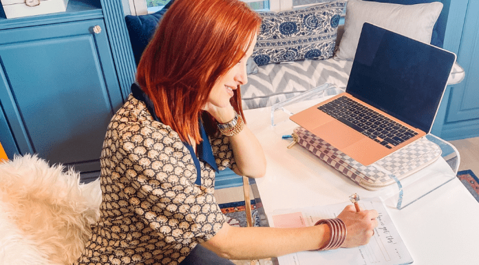 Dacia working at her desk (Steps for Creating Vision and Clarity for the New Year Dacia Wiegandt Contributor Miami Mom Collective)