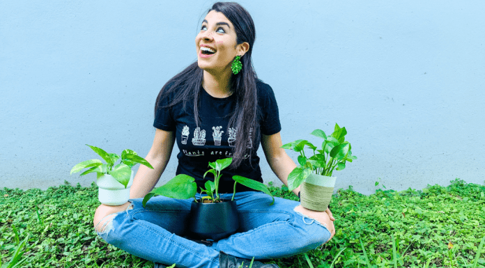 Image: Ana-Sofia holding a few species of pothos plants