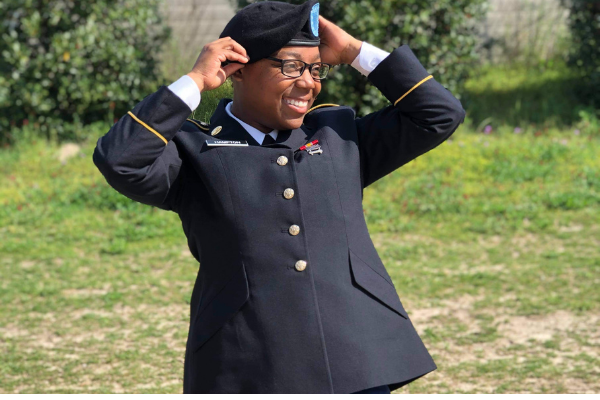 Image: A female soldier wearing a black beret