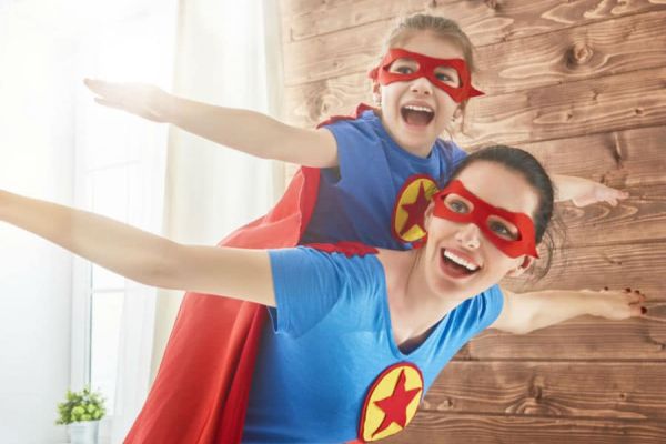A mother and daughter in superhero costumes (Boosting the Immune System for a Great School Year Ahead Adita Lang Contributor Miami Mom Collective)