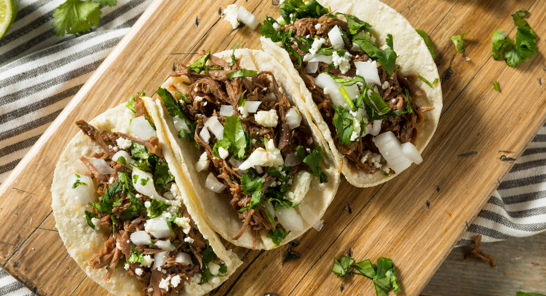 Taco Night Checklist + a Simple Margarita Recipe Image: Fresh homemade tacos on a wooden cutting board