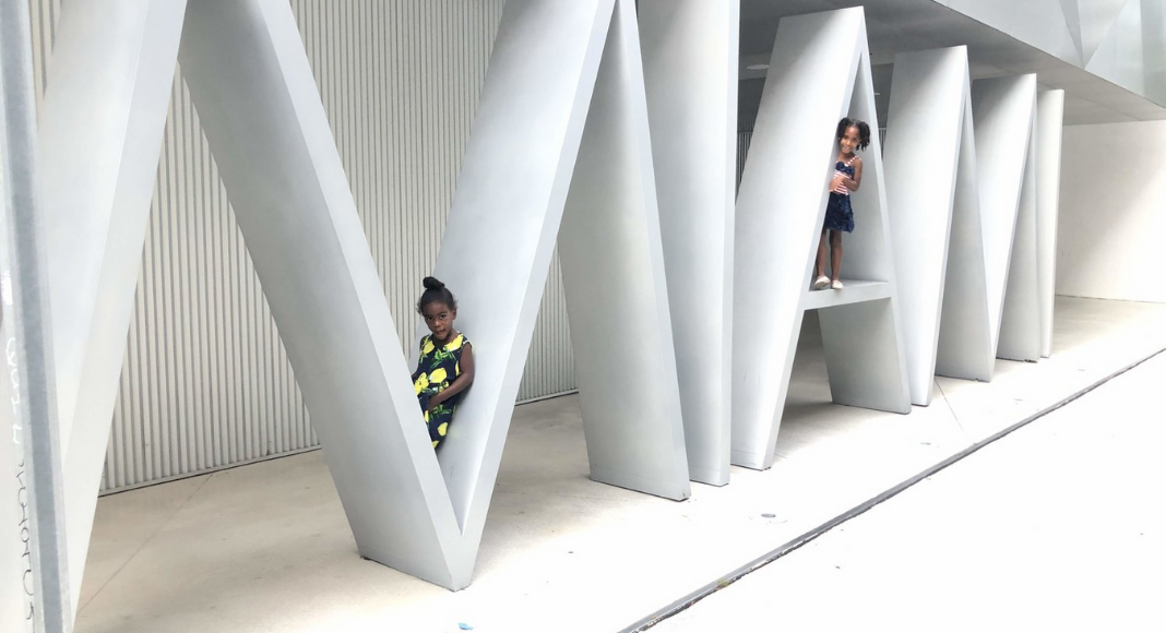 girls sitting on miami sign 3 Things We Did in Miami While Practicing Social Distancing Janeris Marte Contributor Miami Moms Blog