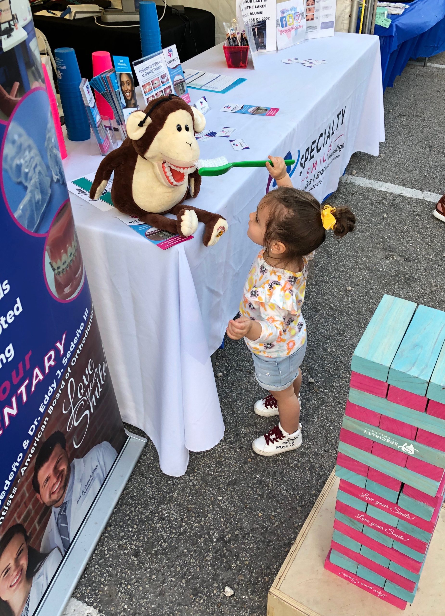 Girl brushing stuffed animal's teeth Lynda Lantz Contributor Miami Moms Blog