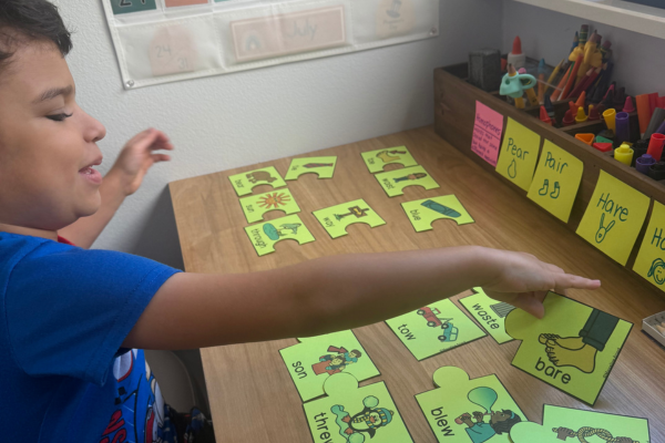 A child works on a vocabulary puzzle at home