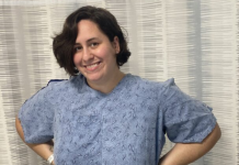 Image: A woman with a hospital gown waiting to have a port placed