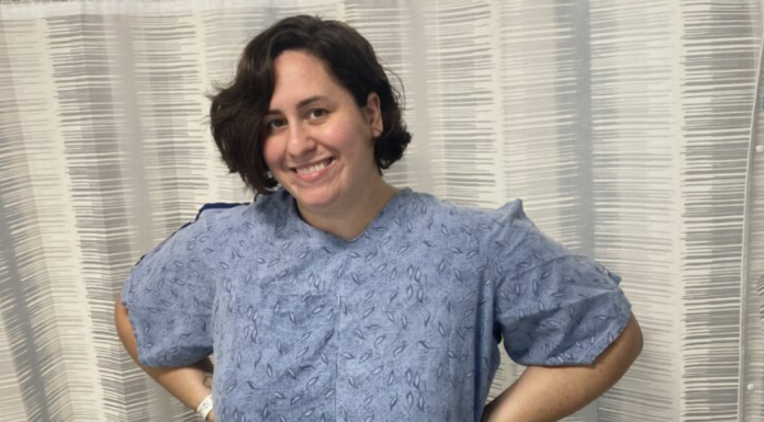 Image: A woman with a hospital gown waiting to have a port placed