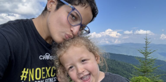 Image: A mother and son with mountains in the background
