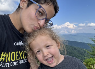 Image: A mother and son with mountains in the background