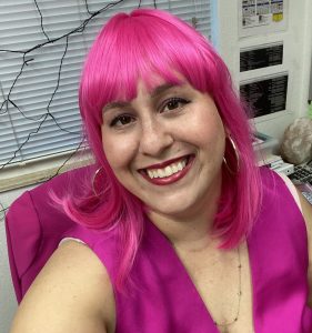 Image: A woman wearing a pink wig