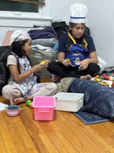 Image: Two children enjoying imaginative play as chefs