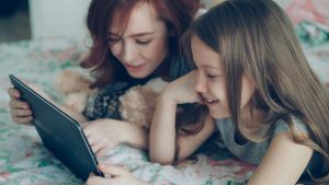 Mom and tween reading together