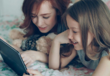 Family Reading: 3 Reasons to Read With Your Tween Image: A mom reading with her tween