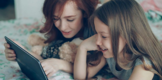 Family Reading: 3 Reasons to Read With Your Tween Image: A mom reading with her tween